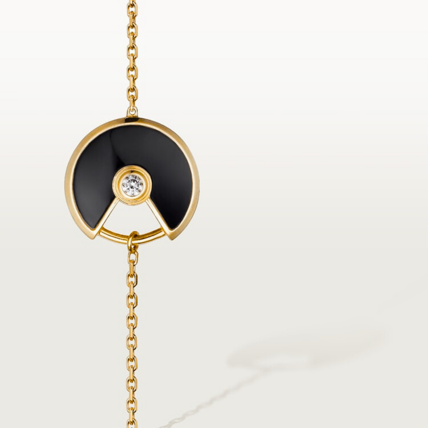 CARTIER CURB CHAIN BLACK ONYX GOLD AMULET