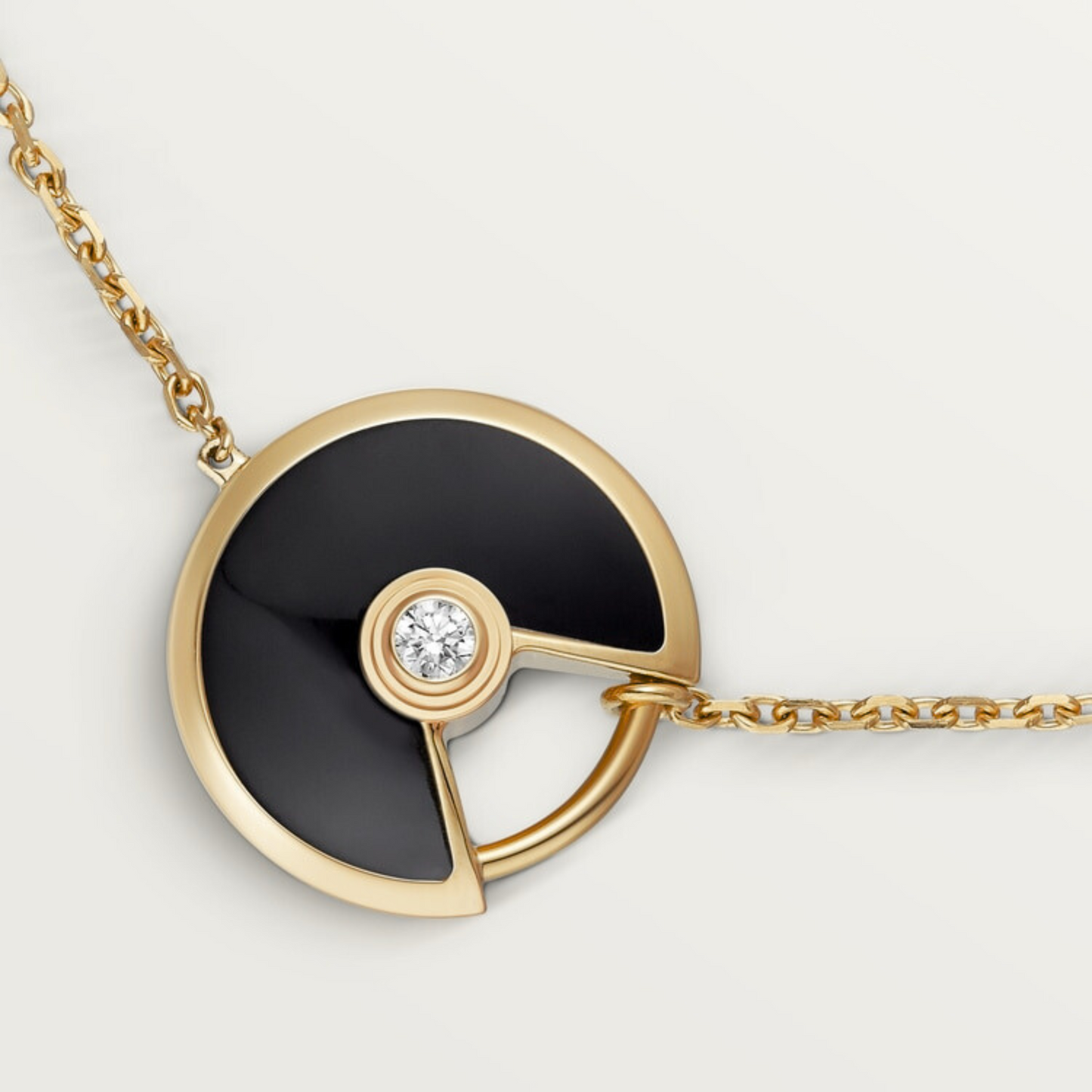 CARTIER CURB CHAIN BLACK ONYX GOLD AMULET